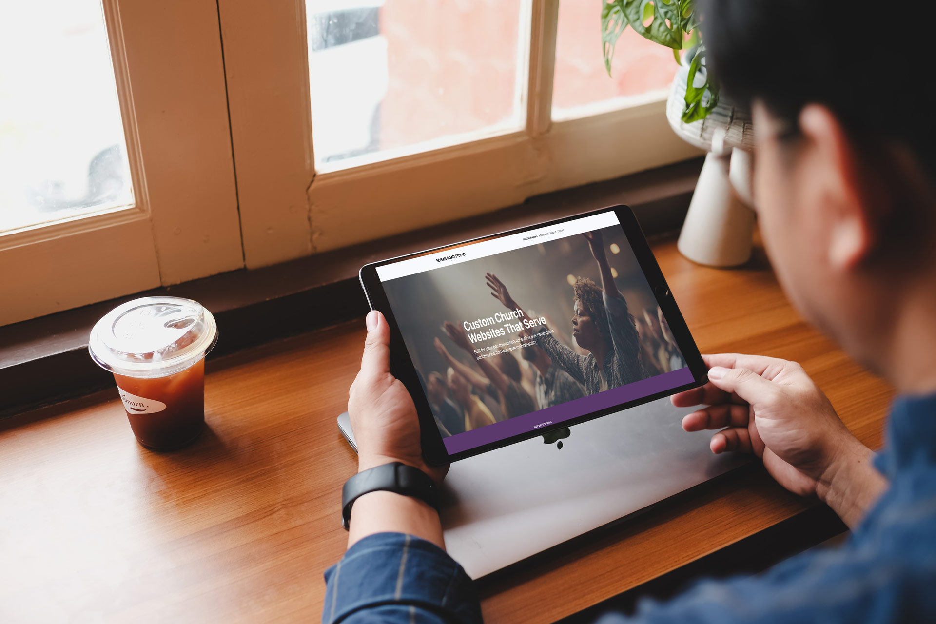 Tablet displaying a church online store interface, representing eCommerce solutions for churches by Roman Road Studio.